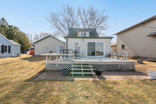 back of house with a patio, a yard, and a wooden deck