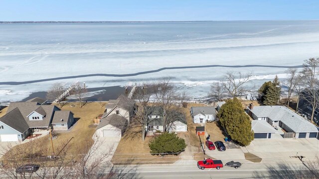 bird's eye view with a residential view and a water view