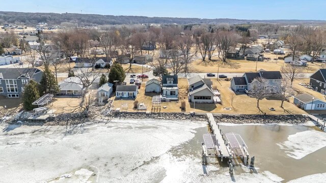 birds eye view of property with a residential view and a water view
