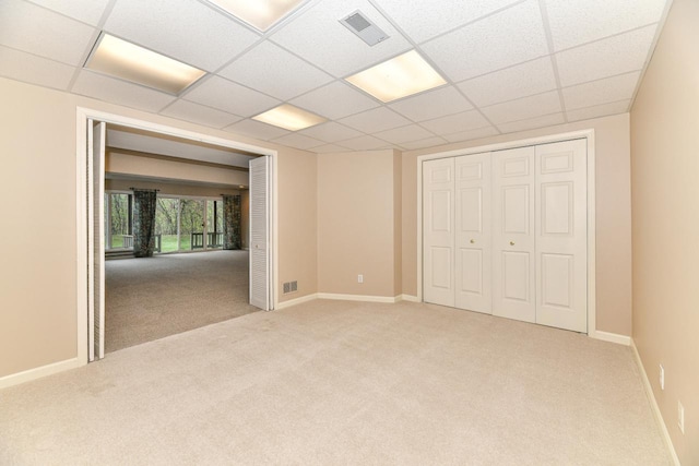 unfurnished bedroom with visible vents, carpet floors, baseboards, and a closet