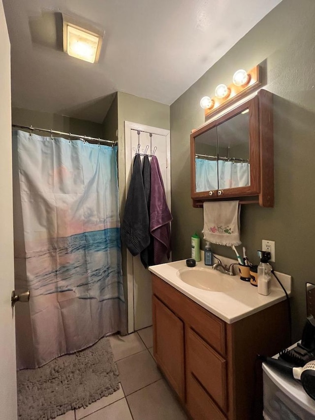 bathroom featuring tile patterned flooring, vanity, and a shower with curtain