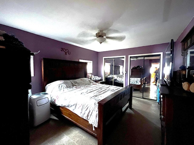 bedroom featuring access to outside and a ceiling fan