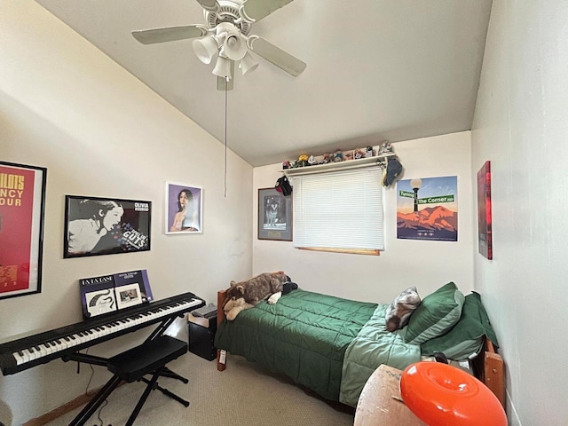 carpeted bedroom with vaulted ceiling and a ceiling fan