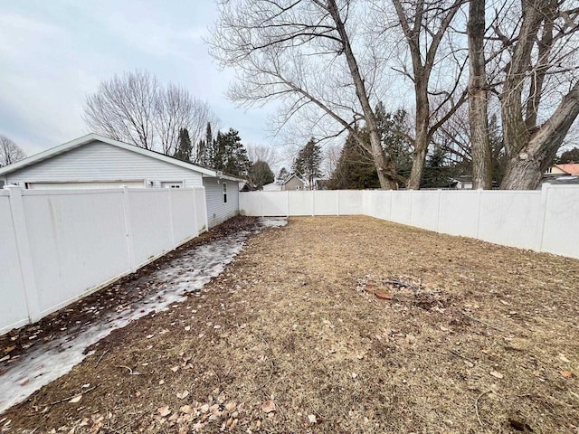 view of yard with a fenced backyard