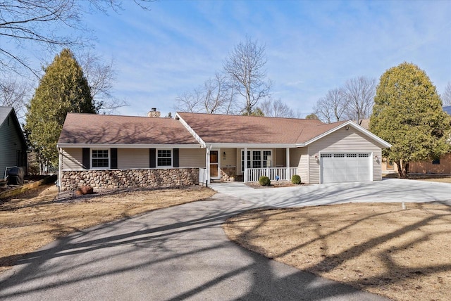 37 E Shore Dr, Random Lake, WI 53075 - single story home with a chimney, an attached garage, a porch, and driveway