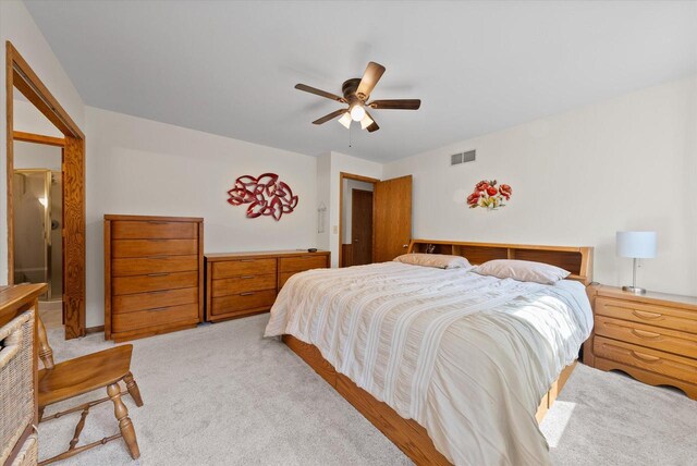 37 E Shore Dr, Random Lake, WI 53075 - bedroom with visible vents, light colored carpet, and a ceiling fan