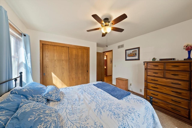 37 E Shore Dr, Random Lake, WI 53075 - bedroom featuring visible vents, baseboards, carpet flooring, a closet, and a ceiling fan