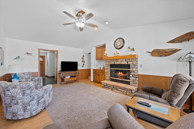 37 E Shore Dr, Random Lake, WI 53075 - living area with vaulted ceiling, a fireplace, a wainscoted wall, and ceiling fan
