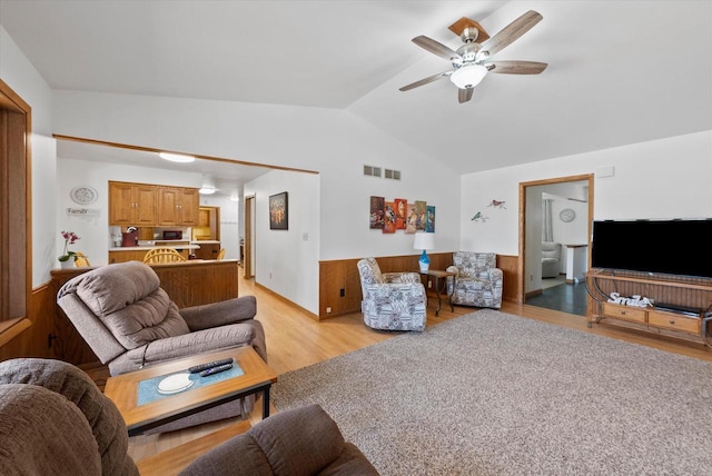 37 E Shore Dr, Random Lake, WI 53075 - living area featuring visible vents, ceiling fan, vaulted ceiling, wainscoting, and light wood-style flooring