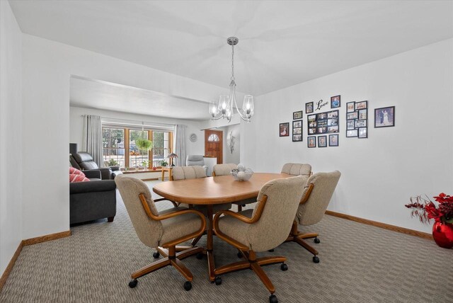 37 E Shore Dr, Random Lake, WI 53075 - dining room with baseboards, an inviting chandelier, and carpet floors