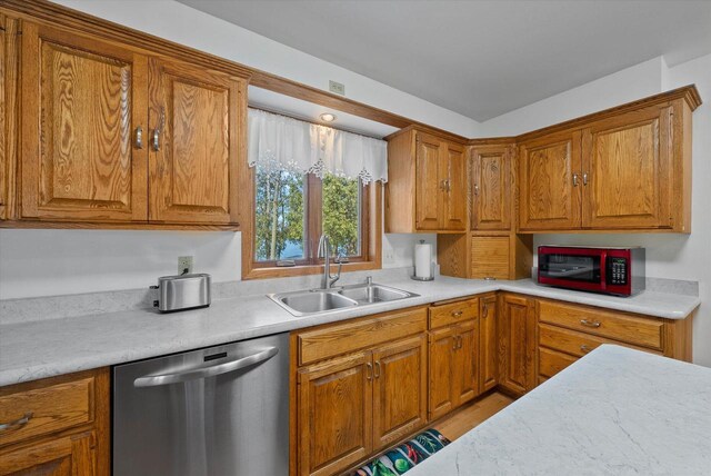 37 E Shore Dr, Random Lake, WI 53075 - kitchen with a sink, brown cabinets, light countertops, and stainless steel dishwasher