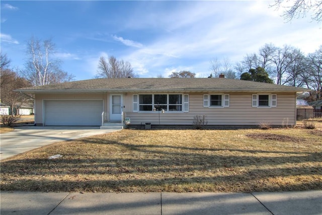 ranch-style house with a garage, a front yard, and driveway