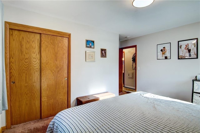 carpeted bedroom with a closet