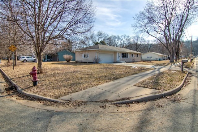 ranch-style home featuring an attached garage