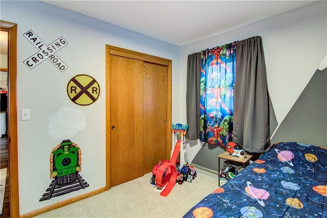 carpeted bedroom featuring a closet