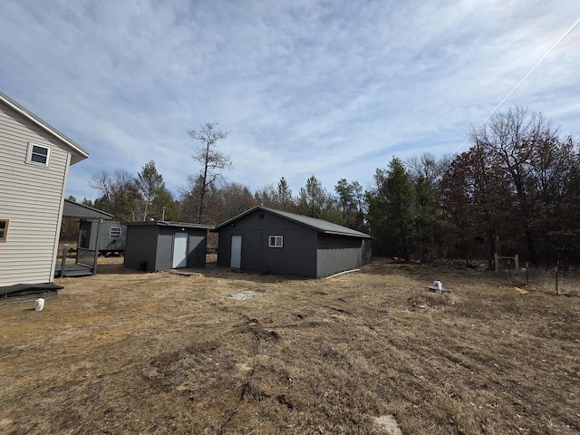 view of yard with an outbuilding and a storage unit