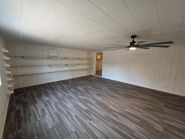 unfurnished room with wood finished floors and ceiling fan