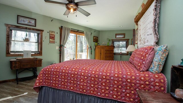 204629 Lake Dr, Rosholt, WI 54473 - bedroom featuring access to outside, ceiling fan, baseboards, and wood finished floors