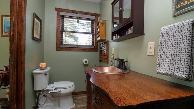 204629 Lake Dr, Rosholt, WI 54473 - half bath with toilet, vanity, and baseboards