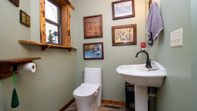 204629 Lake Dr, Rosholt, WI 54473 - half bathroom with visible vents, baseboards, and toilet