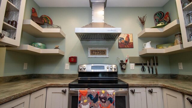 204629 Lake Dr, Rosholt, WI 54473 - kitchen with stainless steel electric stove, white cabinets, wall chimney range hood, and open shelves