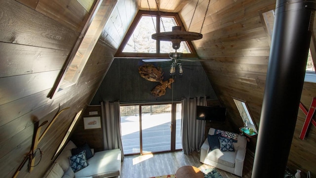 204629 Lake Dr, Rosholt, WI 54473 - living area featuring plenty of natural light, wood walls, wooden ceiling, and wood finished floors