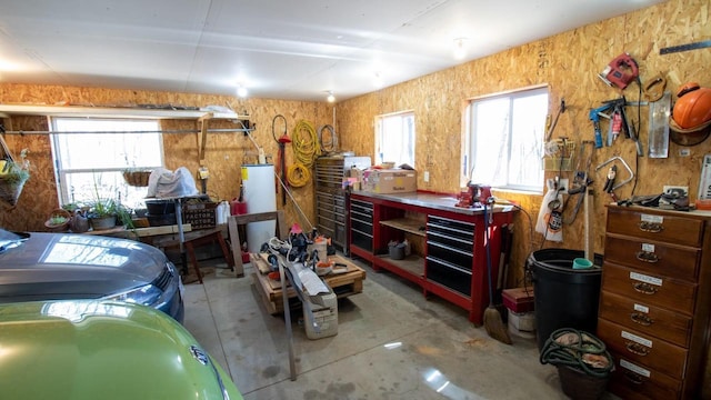 204629 Lake Dr, Rosholt, WI 54473 - interior space with water heater, a workshop area, and concrete floors