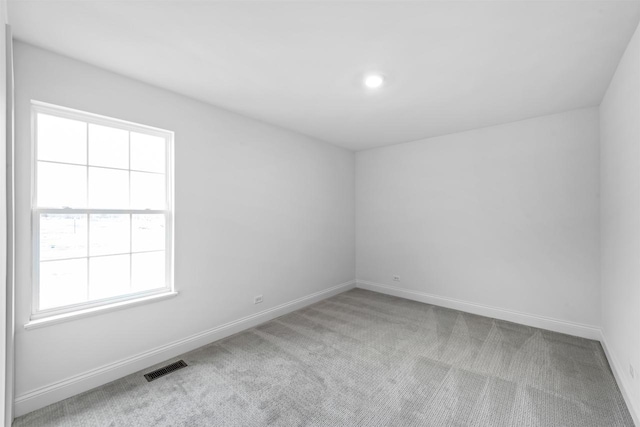 1251 Denmark Cir, Oregon, WI 53575 - carpeted spare room with visible vents and baseboards