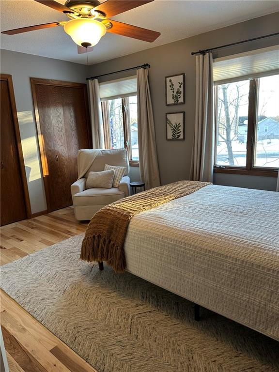 bedroom with wood finished floors and ceiling fan