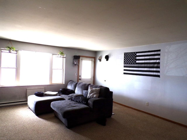 carpeted living area featuring baseboards and baseboard heating