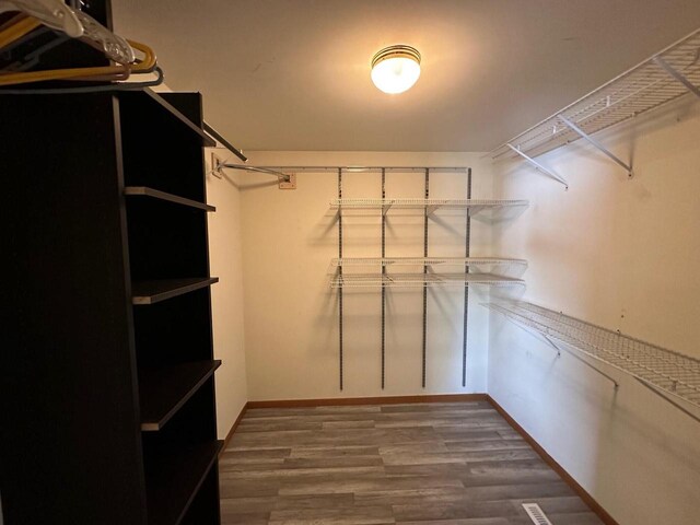 20530 84th Pl, Bristol, WI 53104 - walk in closet featuring dark wood finished floors