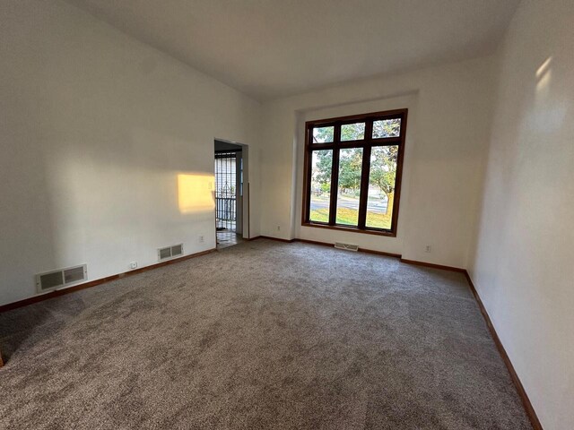 20530 84th Pl, Bristol, WI 53104 - spare room featuring visible vents, baseboards, and carpet floors