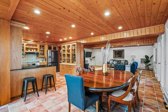 dining space with wooden ceiling, a baseboard heating unit, light tile patterned floors, and recessed lighting