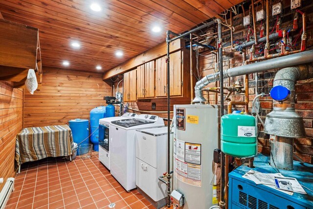 washroom with separate washer and dryer, gas water heater, recessed lighting, wood ceiling, and wooden walls