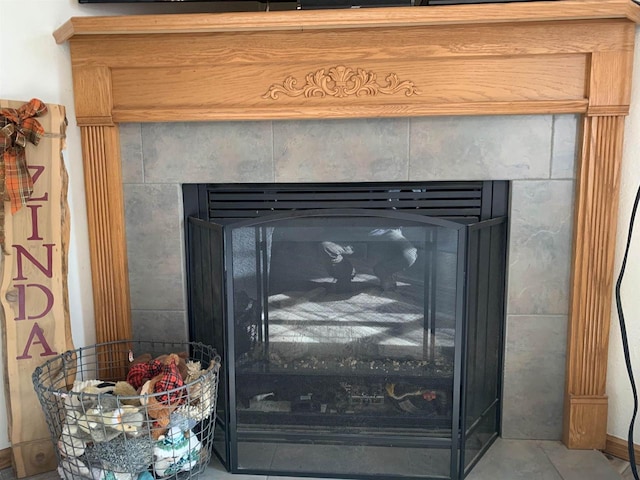 details featuring a tile fireplace