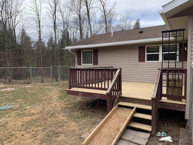 wooden terrace featuring a yard, stairs, and fence