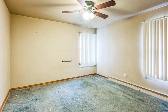 carpeted empty room with a ceiling fan, baseboards, and baseboard heating