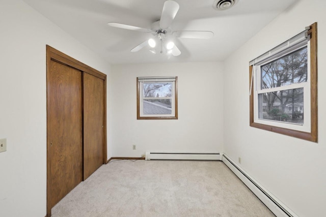 5607 Alben Ave, Mcfarland, WI 53558 - bedroom with visible vents, baseboard heating, a closet, and light colored carpet