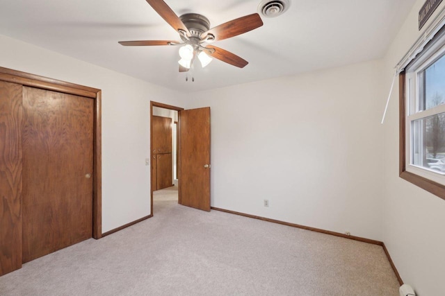 5607 Alben Ave, Mcfarland, WI 53558 - unfurnished bedroom featuring baseboards, visible vents, and light carpet