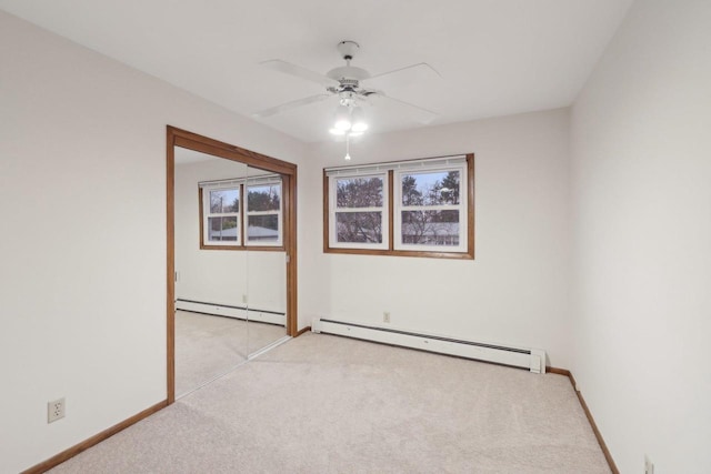 5607 Alben Ave, Mcfarland, WI 53558 - spare room with a ceiling fan, baseboards, baseboard heating, and light carpet