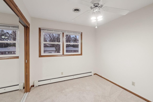 5607 Alben Ave, Mcfarland, WI 53558 - spare room featuring ceiling fan, carpet flooring, baseboards, and a baseboard radiator