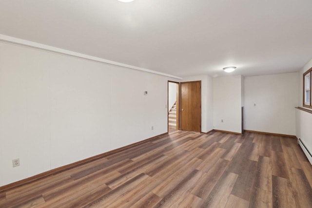 5607 Alben Ave, Mcfarland, WI 53558 - empty room featuring stairway, baseboards, and wood finished floors