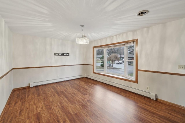 5607 Alben Ave, Mcfarland, WI 53558 - empty room with a baseboard heating unit, wood finished floors, visible vents, and a baseboard radiator