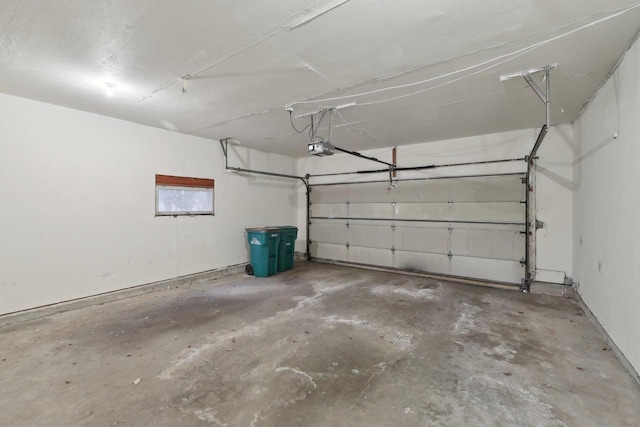 5607 Alben Ave, Mcfarland, WI 53558 - garage featuring a garage door opener