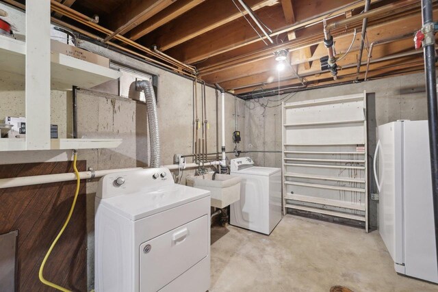 5607 Alben Ave, Mcfarland, WI 53558 - washroom featuring laundry area, washing machine and dryer, and a sink