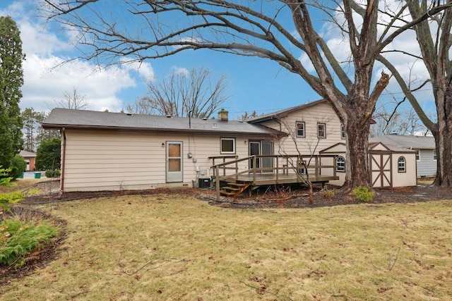 5607 Alben Ave, Mcfarland, WI 53558 - rear view of property featuring a storage unit, a deck, a yard, and an outdoor structure