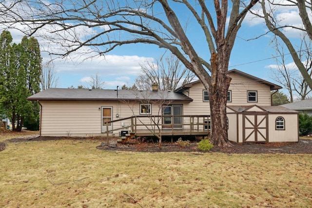 5607 Alben Ave, Mcfarland, WI 53558 - rear view of property with an outbuilding, a lawn, and a wooden deck
