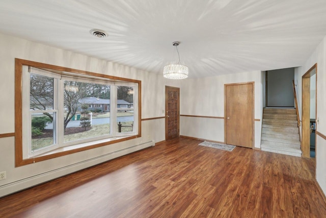 5607 Alben Ave, Mcfarland, WI 53558 - unfurnished dining area featuring a notable chandelier, wood finished floors, visible vents, and a baseboard radiator