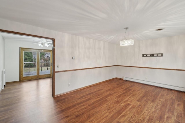 5607 Alben Ave, Mcfarland, WI 53558 - empty room with a baseboard heating unit, visible vents, wood finished floors, and a ceiling fan