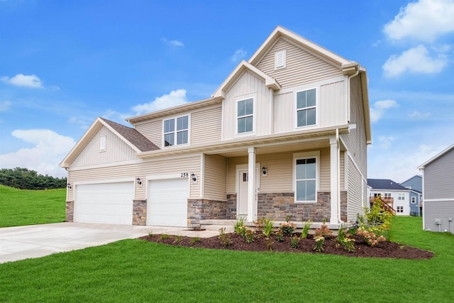 view of front facade featuring stone siding, driveway, and a front yard